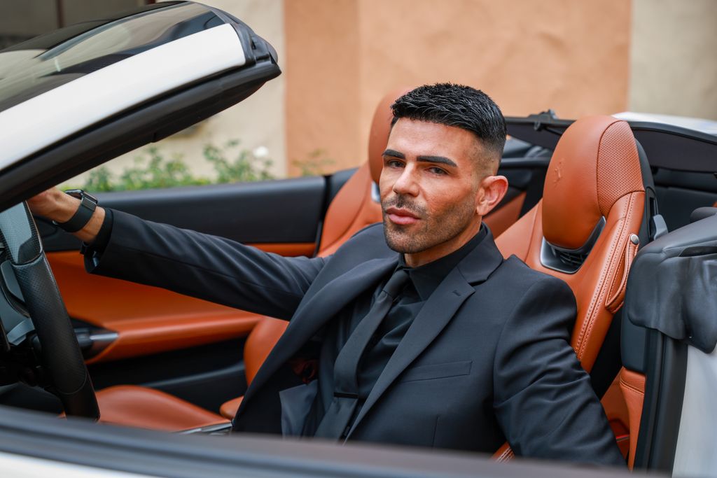 client after photo of man driving a convertible car
