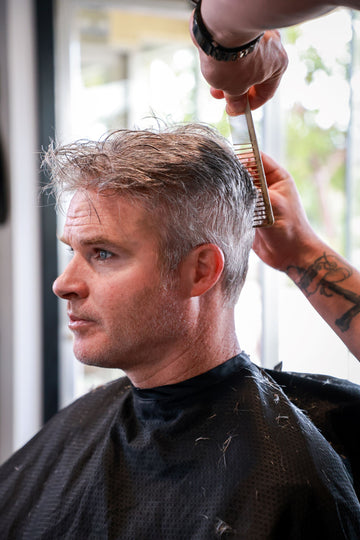 man with grey hair at salon